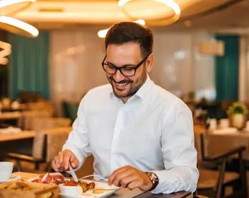 Man eating food at restaurant
